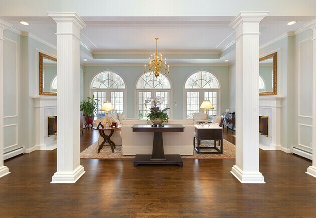 Grand Foyer and Living Room With White Pillars | McSwain Carpet & Floors